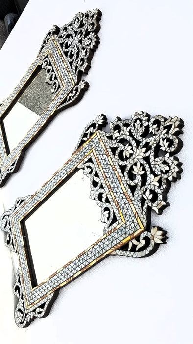 A pair of mother of pearl mirrors
