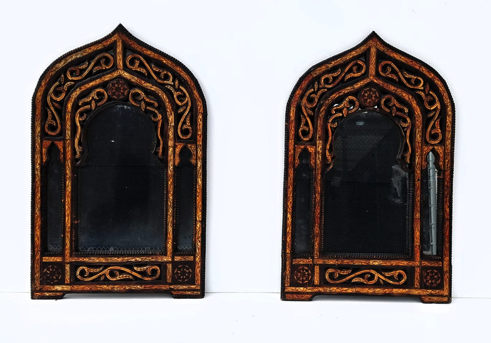 A pair of vintage orange camel bone mirrors