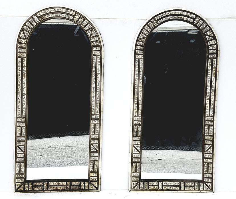 A pair of vintage white bone mirrors