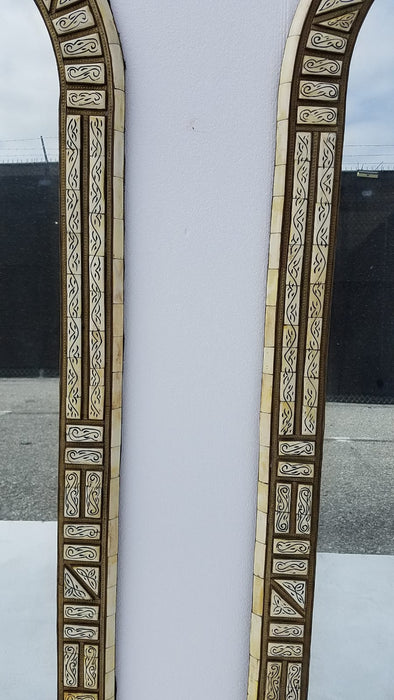 A pair of vintage white bone mirrors