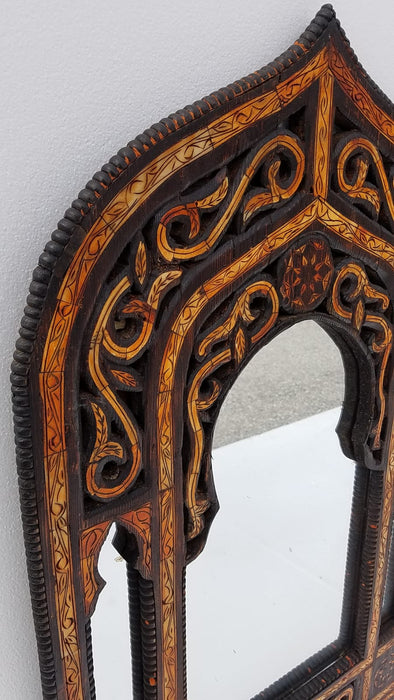 A pair of vintage orange camel bone mirrors