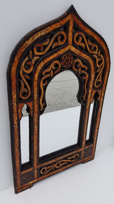A pair of vintage orange camel bone mirrors