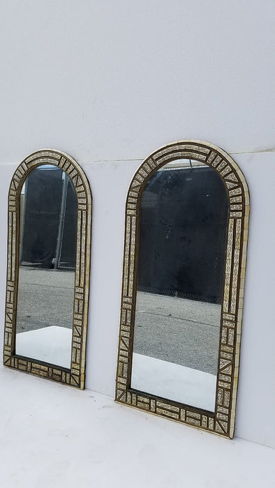 A pair of vintage white bone mirrors